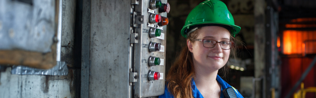 Woman in an engineering hat smiling