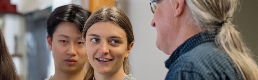 a female student talking to a professor