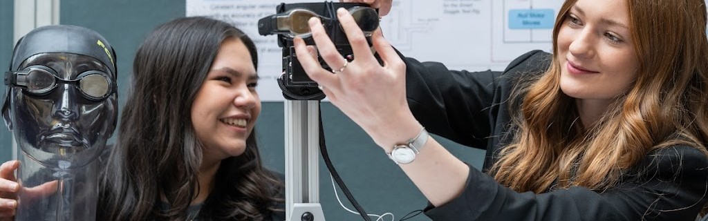 Two females working with goggles