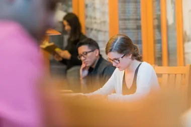 A woman reading in the library