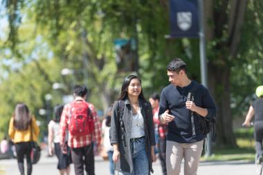 two students walking and talking