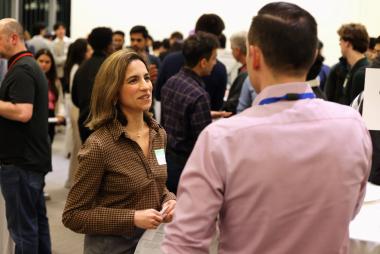 An employer representative speaking with an APSC student during the APSC Co-op Networking Reception 