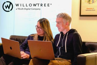 WilloTree, a TELUS Digital Company Stock Image, featuring a WillowTree logo and team members working 