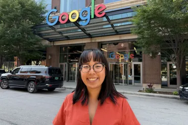 UBC APSC Alum Elysha Htan standing in front of a Google Office