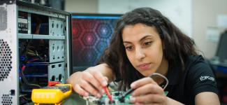 A student working on a circuit board