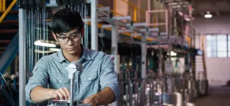 A student working on a machine