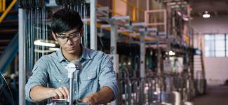 A student working on a machine