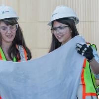 Two students at the construction site.