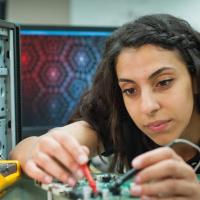 A student working on a circuit board