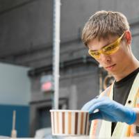 A student working in a warehouse