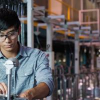 A student working on a machine